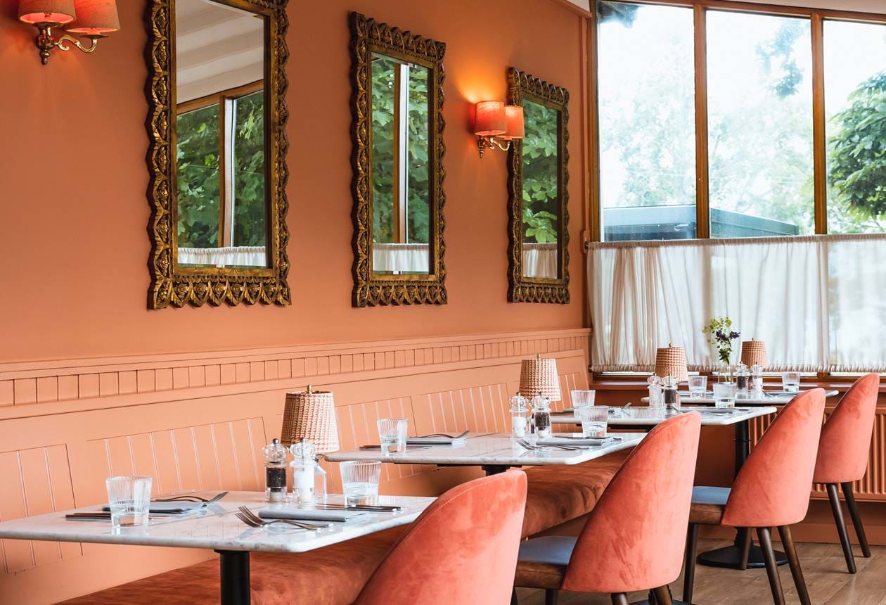 Luxury restaurant at The Torridon hotel in the Scottish Highlands with warm flattering interiors.